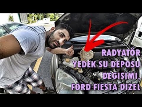 Video: 2004 Ford Escape'teki radyatör kapağı nerede?