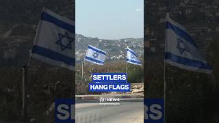 Settlers hang 'Israeli' flags between Arraba and Ya'bad