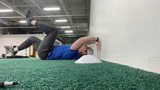 Wall Press Dead Bug Heel Taps