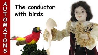 Automatons for sale: the automaton conductor directing mechanical singing birds by Renato Boaretto.