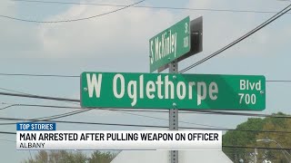 Man faces charges after pulling air gun on an officer, APD says