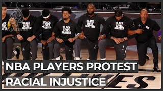 NBA players protest racial injustice as league returns to action