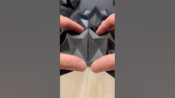 Folding black paper into geometric forms. Origami; Grinder(Black)