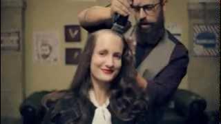 Two women getting their heads shaved