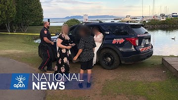 Thunder Bay police officer poses for photos in front of crime scene | APTN News