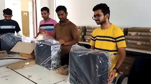 Delivery of the first set of computers for the lab supported by alumni of LDCE.
