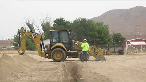 CAT Backhoe Trench by Operator Phenecie