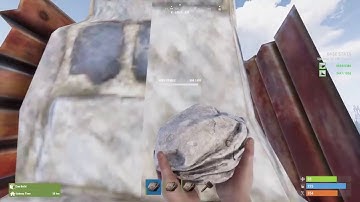 Breaking a high external stone wall with rocks