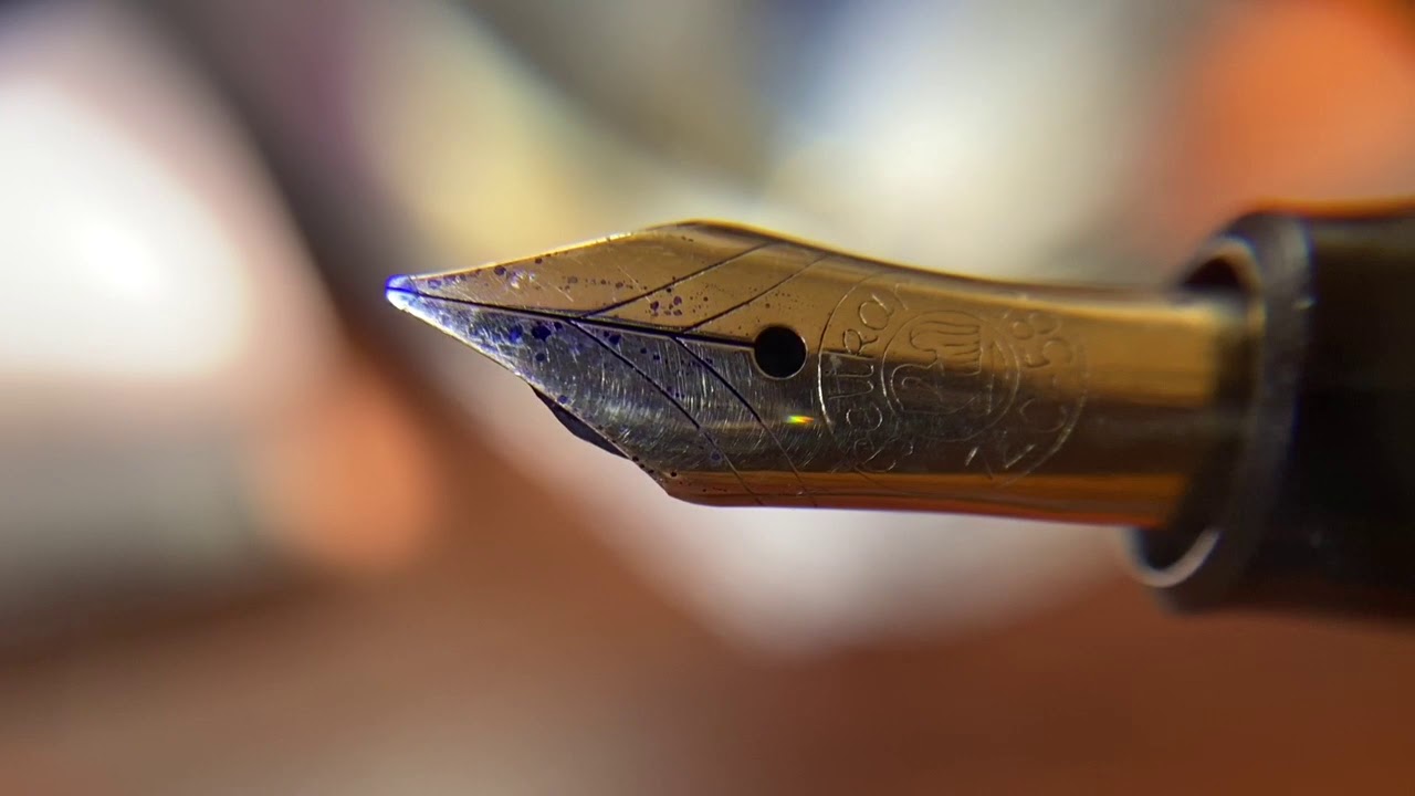 Premium Photo  Close-up of fountain pen on paper