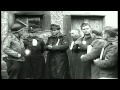 U.S. Army soldiers guard German SS-Totenkopfverbände (SS-TV) prisoners...HD Stock Footage