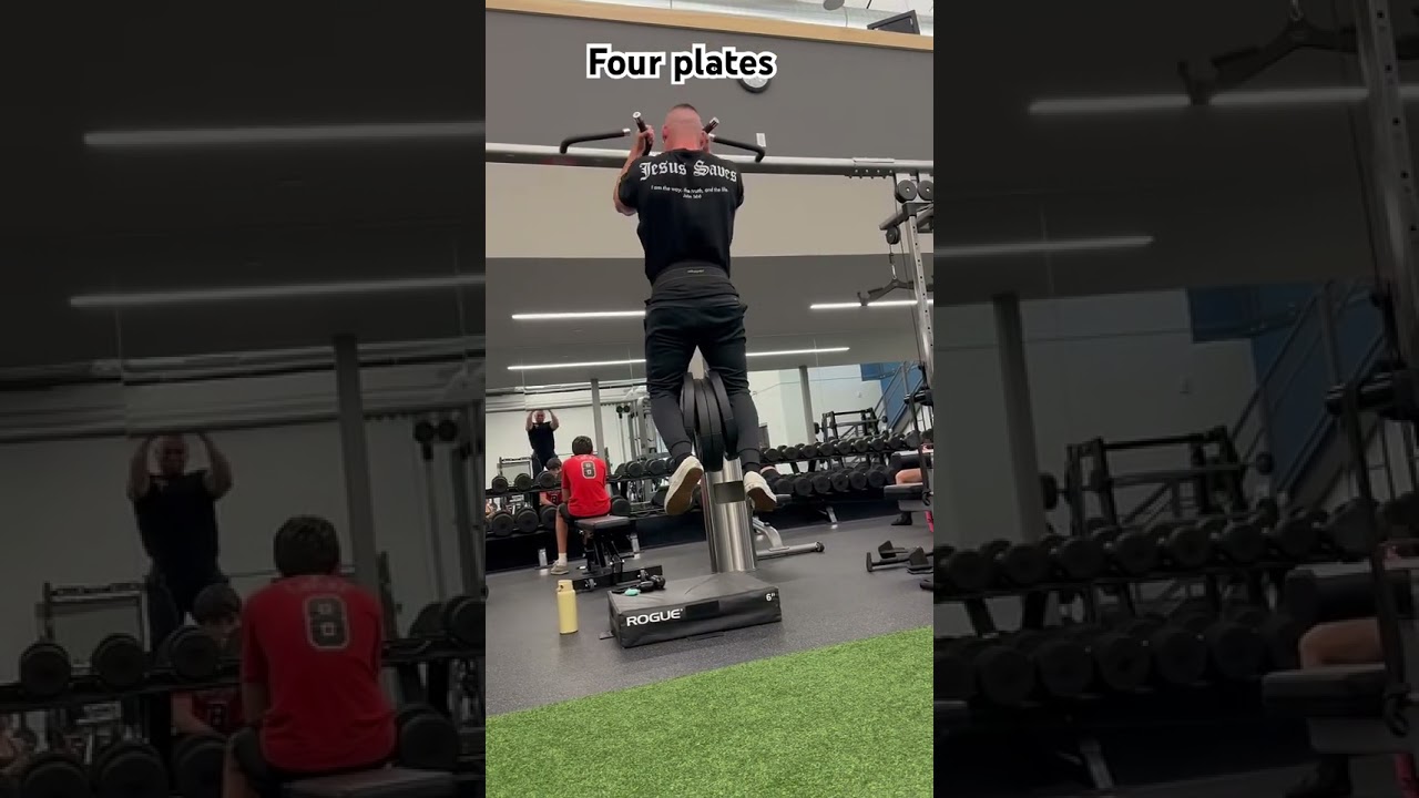 Weighted pull-ups with four plates. 