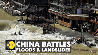 China battles floods & landslides: Rescuers build rope tunnel to evacuate villagers | English News