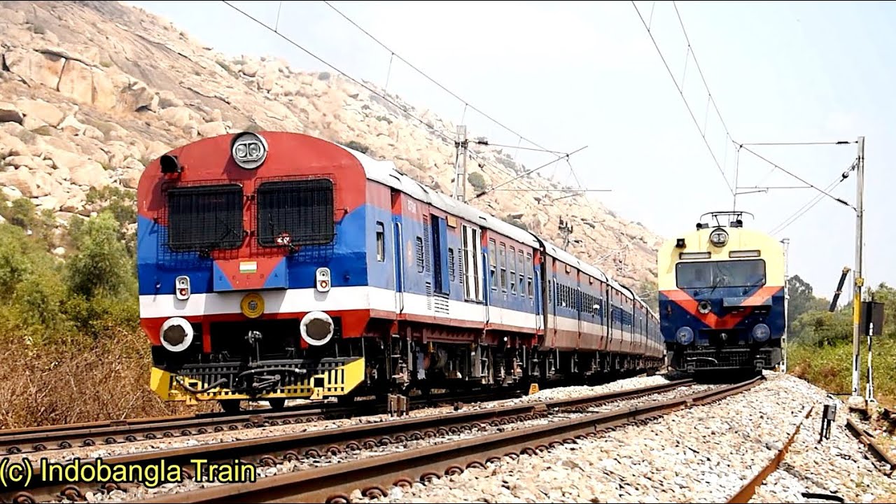 Crossing Between Two Different Colorful Memu Near Tyakal Station in  Karnataka state India