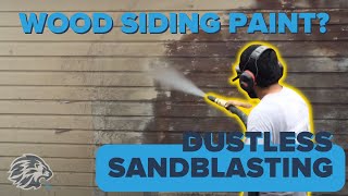 Dustless blasting to strip paint off a wood siding home