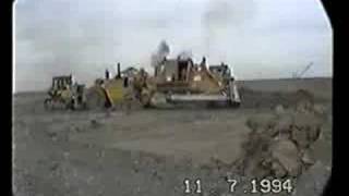 Cat 657 scrapers with a double push