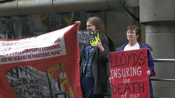 Environmental activists protest outside Lloyd's of London for role insuring coal projects | AFP