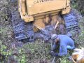 Caterpillar D6D stuck in mud while drum chopping