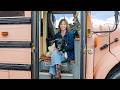 Her adorable tiny home inside of a pink school bus