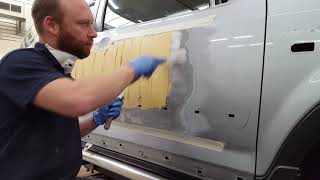 Car Repair: working a big putty job