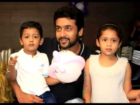 Suriya with his son Dev and daughter Diya, wife Jyothika, father Sivakumar