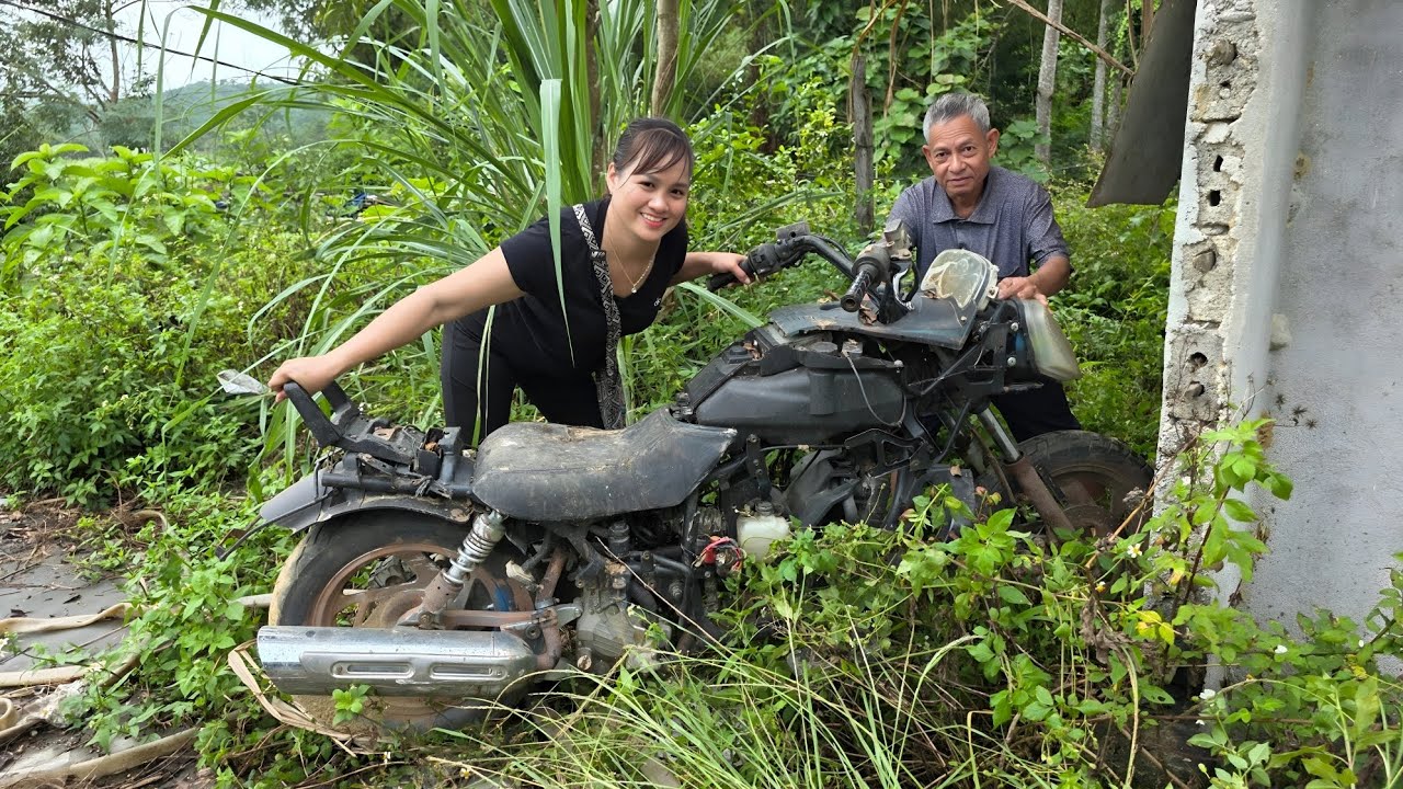 The girl buys, repairs and restores old motorbikes that have been broken for a long time.