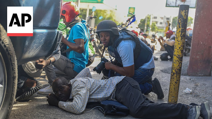 Shootouts break out between police and gangs as Haiti swears in prime minister