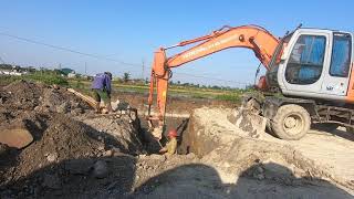 Construction of bamboo piles by excavator