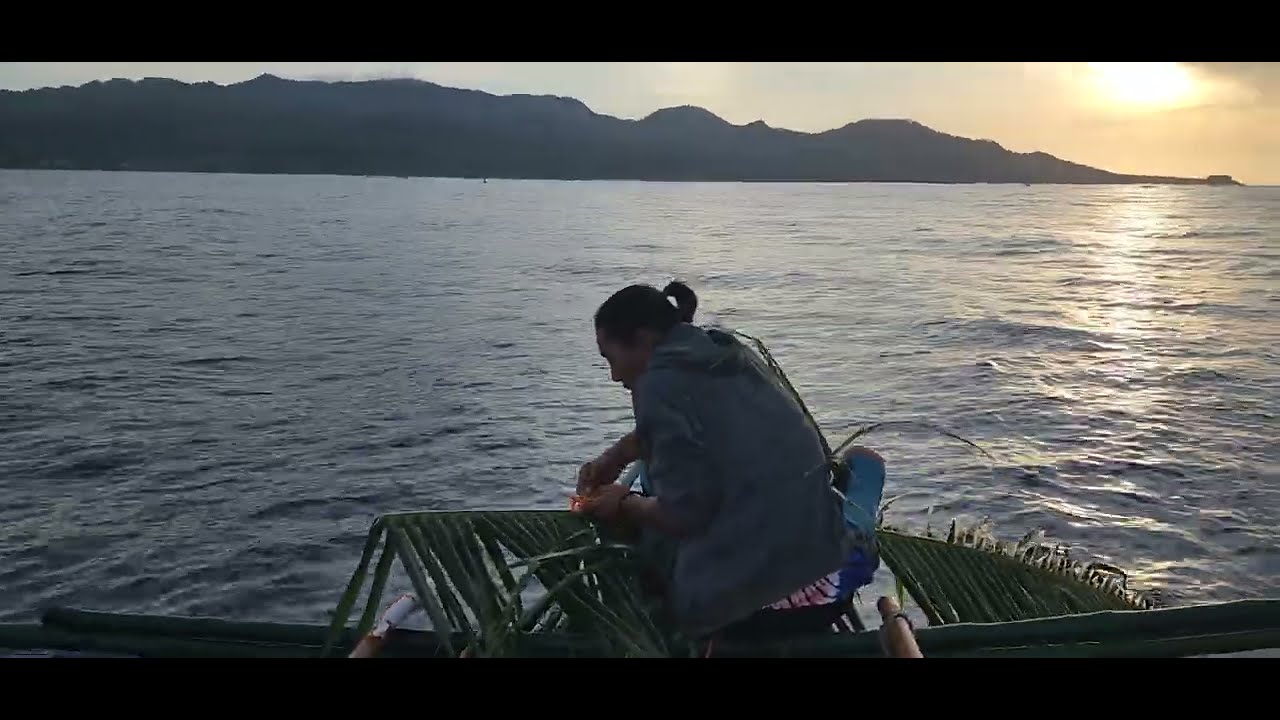 Traditional use of Coconut leaf to stabilize fishing boat in Philippines