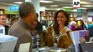 President Barack Obama bought at least two bags of books at Washington's Politics and Prose bookstor