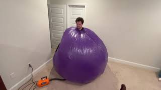 Inflating a 6 foot purple pvc ball suit