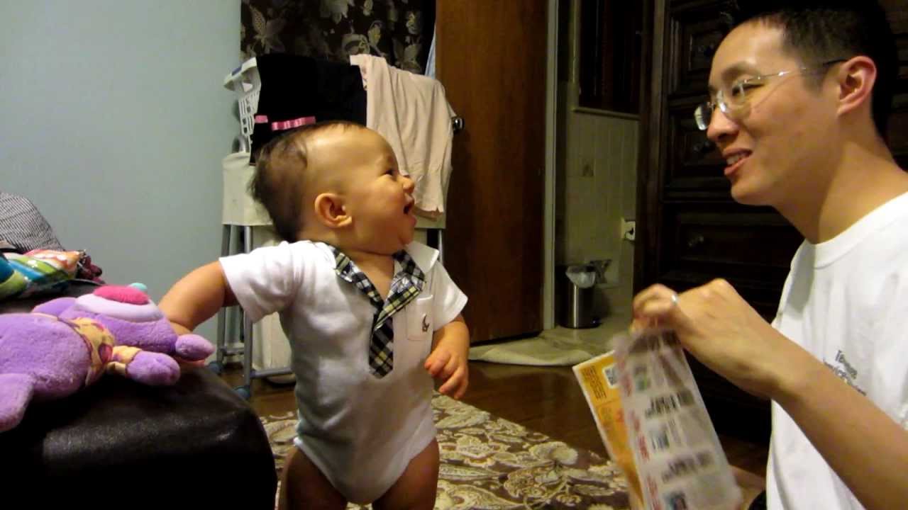 Cute baby laughing hysterically just at the SOUND of ripping paper ...