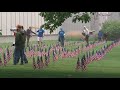 Volunteers plant 2,500 flags outside National Veterans Memorial and Museum to honor fallen heroes