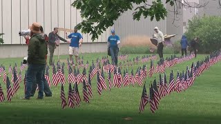 Volunteers plant 2,500 flags outside National Veterans Memorial and Museum to honor fallen heroes