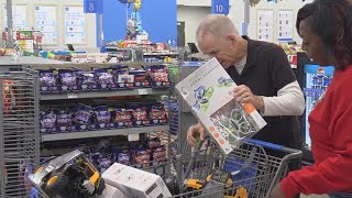 Volunteers assist Department of Family and Protective Services shopping for foster kids' presents