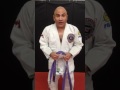 Man promotes himself to new belt in Brazilian Jiu jitsu.