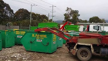 Peninsula Skip Bins- lifting small skip onto truck