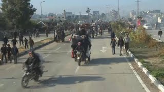 Palestinians begin crossing back into northern Gaza as truce holds