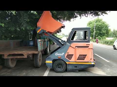 Sweeping Machine dumping process. Ride on sweeper. - video from Cleanland