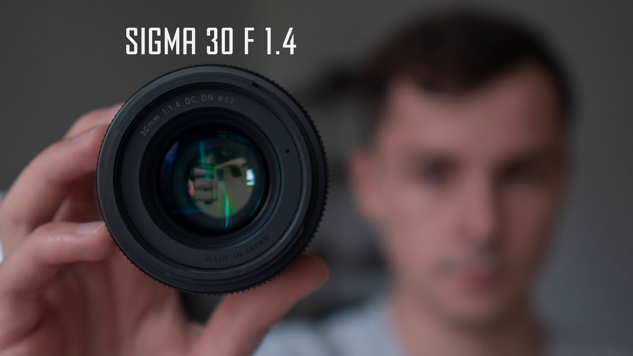 Сигма момент звук. Sigma 30 mm 1.4 DC DN для Sony e Mount. Sigma 30/1.4 Fujifilm Art.