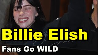 Billie Eilish greets a mob of fans in back alley in LA
