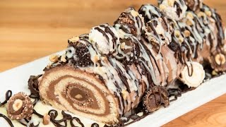 Ferrero Rocher & Nutella Cake Roll from Cookies Cupcakes and Cardio
BUY MY COOKBOOK: http://cookiescupcakesandcardio.com/?page_id=7366
Subscribe: http://goo.gl/tuamEz
Subscribe to our NEWSLETTER here: http://madmimi.com/signups/28657/join
Today I show you how to make a decadent dessert combining three of your (and mine) favuorite things- cake, Ferrero Rochers and Nutella!
Visit my blog at: http://cookiescupcakesandcardio.com
Watch me LIVE on Periscope @cupcakeNcardio
Instagram: http://instagram.com/CupcakesandCardio#
Pinterest: http://pinterest.com/cupcakescardio
Facebook: https://www.facebook.com/CookiesCupcakesandCardio/
Google+: https://plus.google.com/u/0/+Cookiescupcakesandcardio
Tumblr: http://cookiescupcakesandcardio.tumblr.com/
Twitter: https://twitter.com/CupcakeNCardio
Ferrero Rocher and Nutella Cake Roll
Ingredients:
Cake roll batter https://youtu.be/f2lVkHEwEgs
Nutella Buttercream https://youtu.be/OMrRi9etWtg
Chocolate Ganache https://youtu.be/UFW59OLLoDc
White chocolate ganache
Ferraro Rochers
Chopped hazelnuts
Procedure:
1. Preheat oven to 375F.
2. Line a jelly roll pan with wax paper, and spray liberally with non stick spray.
3. Pour cake batter into the pan, and spread flat with an offset spatula.
4. Bake for 10 minutes, or until cake springs back after being touched.
5. Remove from oven and immediately invert onto a piece of parchment paper. Gently roll the cake up, with the parchment paper, starting at one end, and set aside to cool.
6. When cooled, unroll cake and spread on Nutella buttercream. Place a line of Ferraro Rochers at the start of the roll, and re-roll the cake around the chocolates.
7. Place cake roll onto a long rectangular cake.
8. Top cake roll with additional Ferraro Rochers (whole and halved), ganaches, and chopped nuts.
9. Slice and serve so each piece has a Ferrero from the center of the roll.
10. Cake can be kept in the fridge and is best consumed within 2-3 days.
Cake Roll batter
Ingredients:
1 cup flour (120g)
1 teaspoon baking powder (5mL)
1/2 teaspoon salt (2.5mL)
4 eggs
1 cup granulated sugar (200g)
1 teaspoon lemon juice (5mL)
1/4 cup milk (hot) (60mL)
Procedure:
1. Combine the flour, baking powder and salt. Mix and set aside.
2. In a stand mixer, whip the eggs, sugar and lemon juice until thick.
3. Heat the milk and slowly add it to the egg mixture and whip until very thick.
4. Add half of the flour mixture to the egg mixture, and use a spatula to fold together. Once combined, add remaining flour amount and continue to fold until incorporated.
Chocolate Ganache
Ingredients:
1 tablespoon Butter
2/3 cup heavy cream (whipping cream)
1 1/4 cups chocolate chips (8 ounces)
Procedure:
1. Heat cream in microwave until very hot.
2. Add chocolate chips and butter and let sit for 5 minutes.
3. Stir until chips melt and mixture becomes smooth.
4. Allow to cool slightly before using.
Nutella Buttercream
Ingredients:
1 cup butter, softened to room temperature
2 cups icing sugar
3/4 cup Nutella
3-4 Tablespoons heavy cream or milk
2 teaspoons vanilla extract
Procedure:
1. In bowl of a stand mixer, cream butter until light and fluffy.
2. Add icing sugar and combine.
3. Add vanilla, Nutella and cream one tablespoon at a time until desired consistency is reached. Ferrero Rocher & Nutella Cake Roll from Cookies Cupcakes and Cardio