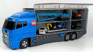 Giant Blue Truck Carries Miniature Construction Equipment Inside