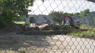 Sinkhole repair appears to begin at Urbandale apartments after months of disruption
