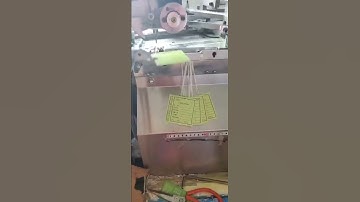 Automatic tag theading knotting machine