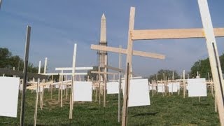 Newtown clergy plant crosses for gun control