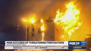 Man accused of threatening Indy firefighters during house fire