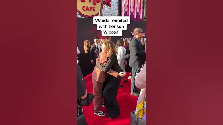 Elizabeth Olsen hugging Julian Hilliard