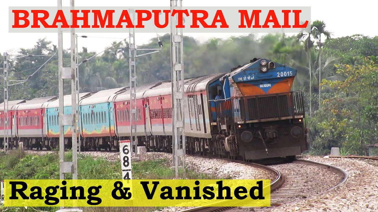 High Speed Curving Train Brahmaputra Mail Raging Vanishes In A Huge train-ke-sath-mein-bhabhi-ki-scorpio-dekhiae-iski-top-speed-kya-hai