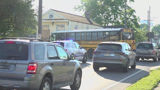 Children and driver injured after car crashes into school bus in New Orleans