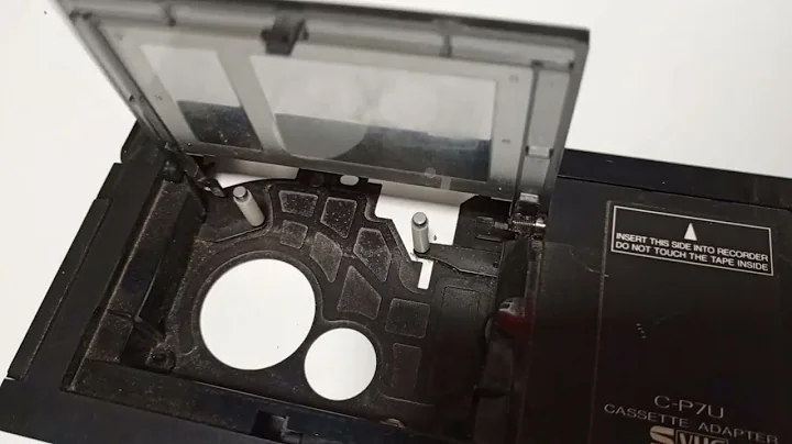 Testing a dusty JVC C-P7U vintage VHS-C to VHS adapter. Working mechanics.